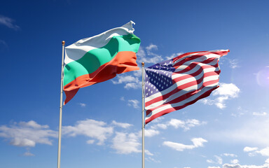 Beautiful national state flags of USA and Bulgaria together at the sky background. 3D artwork concept.