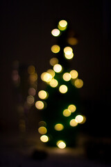 Fototapeta premium gold light bokeh in form of bottle or christmas tree