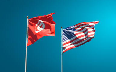 Obraz premium Beautiful national state flags of Tunisia and USA together at the sky background. 3D artwork concept.