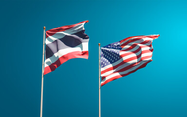 Beautiful national state flags of Thailand and USA together at the sky background. 3D artwork concept.