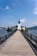 Fototapeta na wymiar Water Castle Schloss Ort with Wooden Bridge in Upper Austria