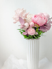 Bouquet of Ranunculus flowers in white vase