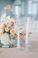 Table setting at a luxury wedding and Beautiful flowers in a vase on the table.