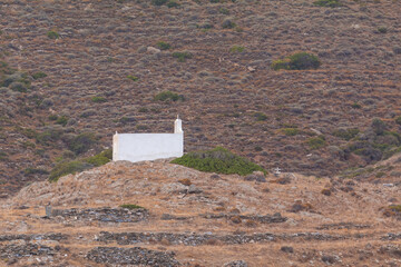 Fototapeta premium Traditional white chapel , Ios island, Greece.