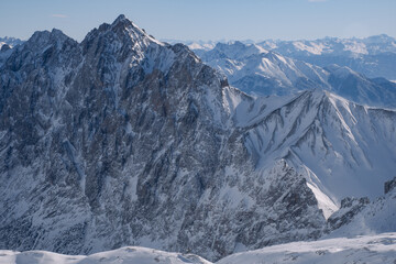 Snow-covered mountains in the Alps in winter, seen from the Zugspitze mountain peak