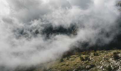 View at canyon from top of mountain with thick clouds.