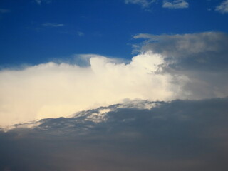 Beautiful multi-colored sky with a cloud before a thunderstorm and rain in autumn in Israel close-up. The photo can be used as a banner for advertising. There is room for text.