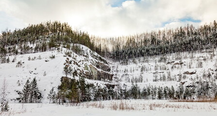 Old abandoned quarry for the extraction of talc in the winter