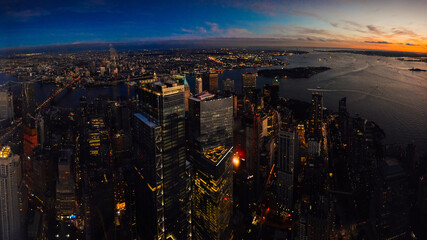 Amazing autumn sunset view from One World Trade Center  sky scraper in New York to South Manhattan...