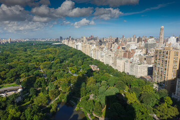 Fototapeta na wymiar Top view over Central Park in Manhattan during a day with blue sky and white clouds in New York