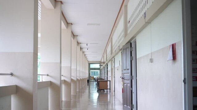 High School hallway corridor in College or university empty hall at classroom, no people student while closed quarantine in situation of Covid-19 disease outbreak result in inability organize learning
