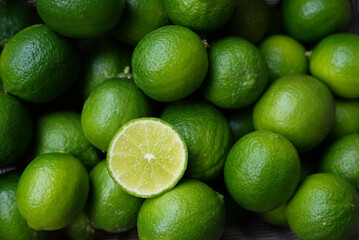 Selective focus at half lime with clusters lime, view from above, placed in a basket