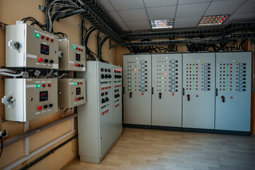 Electrical switchgear cabinets with control panels with indicator lights in factory
