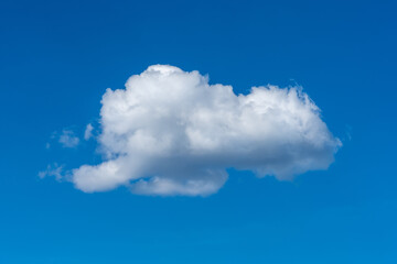 Single white cloud on a blue summer sky