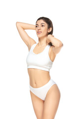Fototapeta premium Confident. Beautiful female model on white background. Beauty, cosmetics, spa, depilation, diet and treatment, fitness concept. Fit and sportive, sensual body with well-kept skin in underwear.