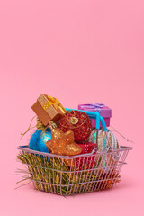 Fototapeta na wymiar christmas ornaments in a shopping basket