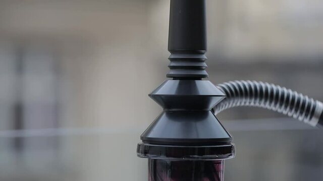Coals on the bowl of shisha in the arabic cafe.image of traditional hookah hot coals for smoking and leisure in natural lighting, close up, lounge caffee