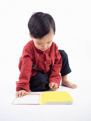 Naklejka premium Happy Chinese new year. Asian boy in cheongsam of traditional chinese dress on white background.