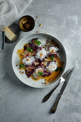 Jerky beef with caramelized beets. A dish for a restaurant. Dark tones