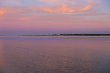 pink and purple sunset at the beach