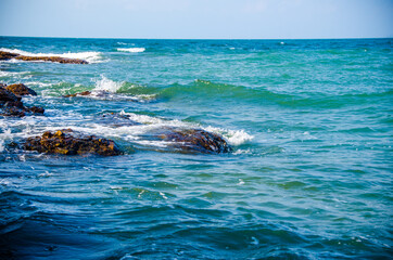 Ocean waves breaking on the rocks on the shore. - 391541742