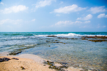 Ocean waves breaking on the rocks on the shore. - 391542799