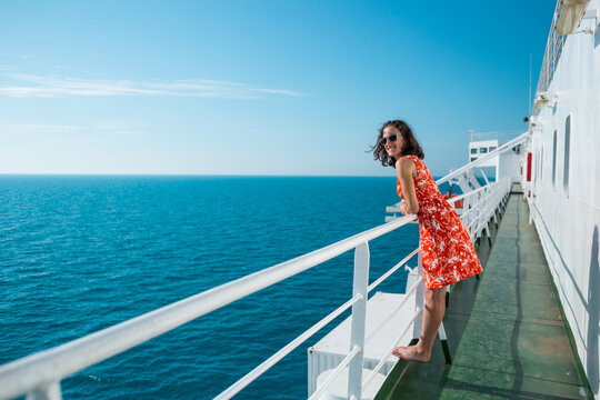 A woman is sailing on a cruise ship