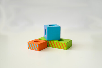 wooden blocks toys for children play in home and kindergarten. Cube and rectangle. different colours. constructor from wooden part