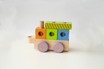 Obraz premium wooden blocks toys for children play in home and kindergarten. Cube and rectangle. different colours. constructor from wooden part