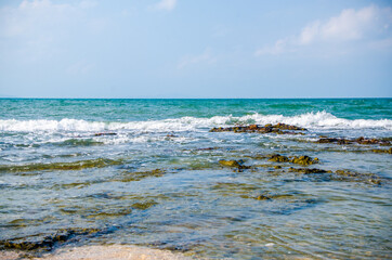 Ocean waves breaking on the rocks on the shore. - 391543181