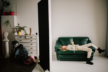 Blonde fashion model woman in interior studio. Emotional portrait of Blue eyed young girl in casual clothes. Lifestyle portrait of modern youth