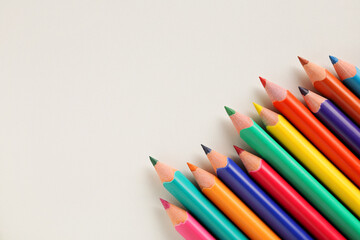 Colour pencils isolated on white background close up. Copy space