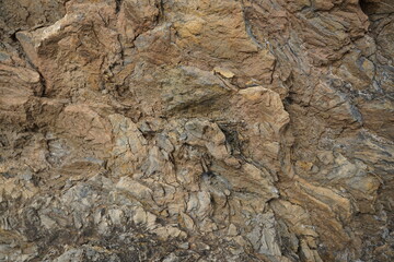 Obraz na płótnie Canvas Brown gray rock texture. Stone background. Light brown rough background. Sandstone. Stone surface with cracks.