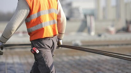 Buildings of logistics center, warehouses in field near the highway, view from height, trucks near the warehouse.