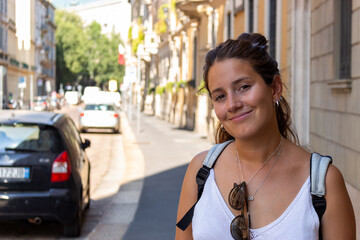 Beautiful young woman smiling in the city center of Milan - Italy