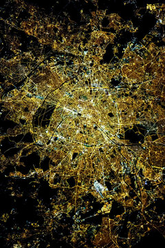 Satellite view of the city of Paris at night from space. Elements of this image furnished by NASA.