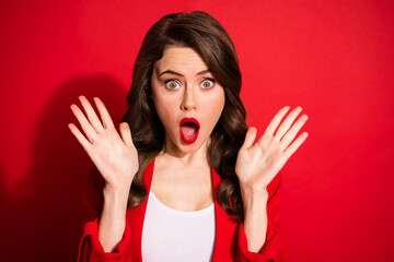Photo of pretty young crazy girl open mouth staring camera palms bright make up wear blazer isolated red color background