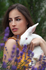 young woman and white bunny - 391553745