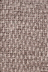 Naklejka na ściany i meble Close-up of woven surface. Pale brown tinted fabric background or wallpaper. Light vertical backdrop for sewing or handicraft. Top view from above