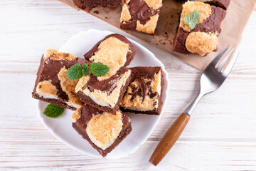 Trend baking Brookies chocolate brownies and cookies homemade cake sliced by squares in a white plate