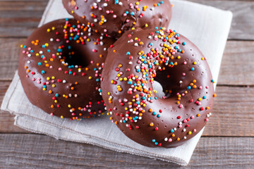 Donut with Chocolate Icing and Sprinkles on a table