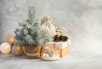 Christmas or New Year composition. Christmas tree, candle, garland. Place for text.
