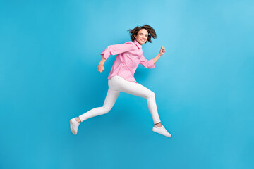Fototapeta na wymiar Full body profile side photo of lady jump run fast empty space isolated over blue pastel color background