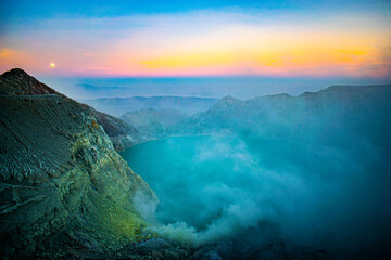 sunrise over the valley and sulphur volcano of Mount Ijen in East Java, Indonesia 
