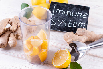 Fall immune system booster - ginger, lemon and honey on a white table