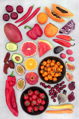 Fruit & vegetables high lycopene & anthocyanins to reduce cholesterol for a healthy heart with foods also high in antioxidants, omega 3, vitamins, minerals & dietary fibre. Flat lay on mottled grey.