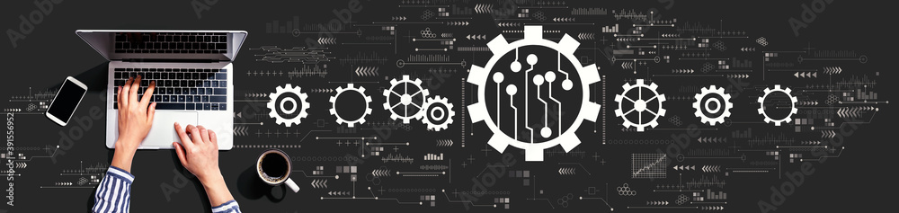 Poster automation concept with person using a laptop computer