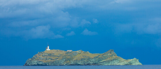 Giraglia island and lighthouse in the blue Mediterranean Sea, Cape Corse, Haute-Corse department, Corsica, France