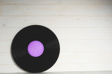 Vinyl record on wooden background,Old vintage vinyl record isolated