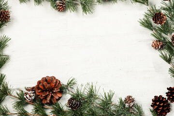 Fototapeta na wymiar Happy New Year 2020 greeting card. Christmas branches on rustic wooden background. Space for text. Top view
